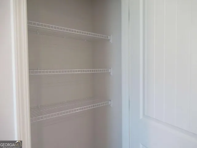 a view of a room with racks on the wall