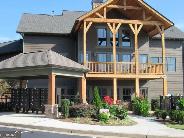 a view of a swimming pool with outdoor seating