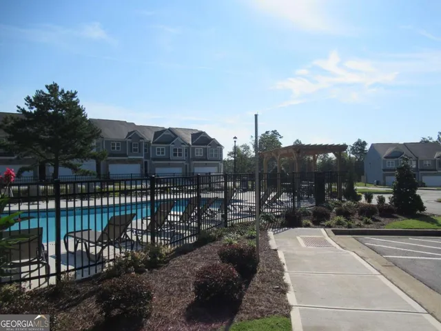 a view of a swimming pool with a terrace