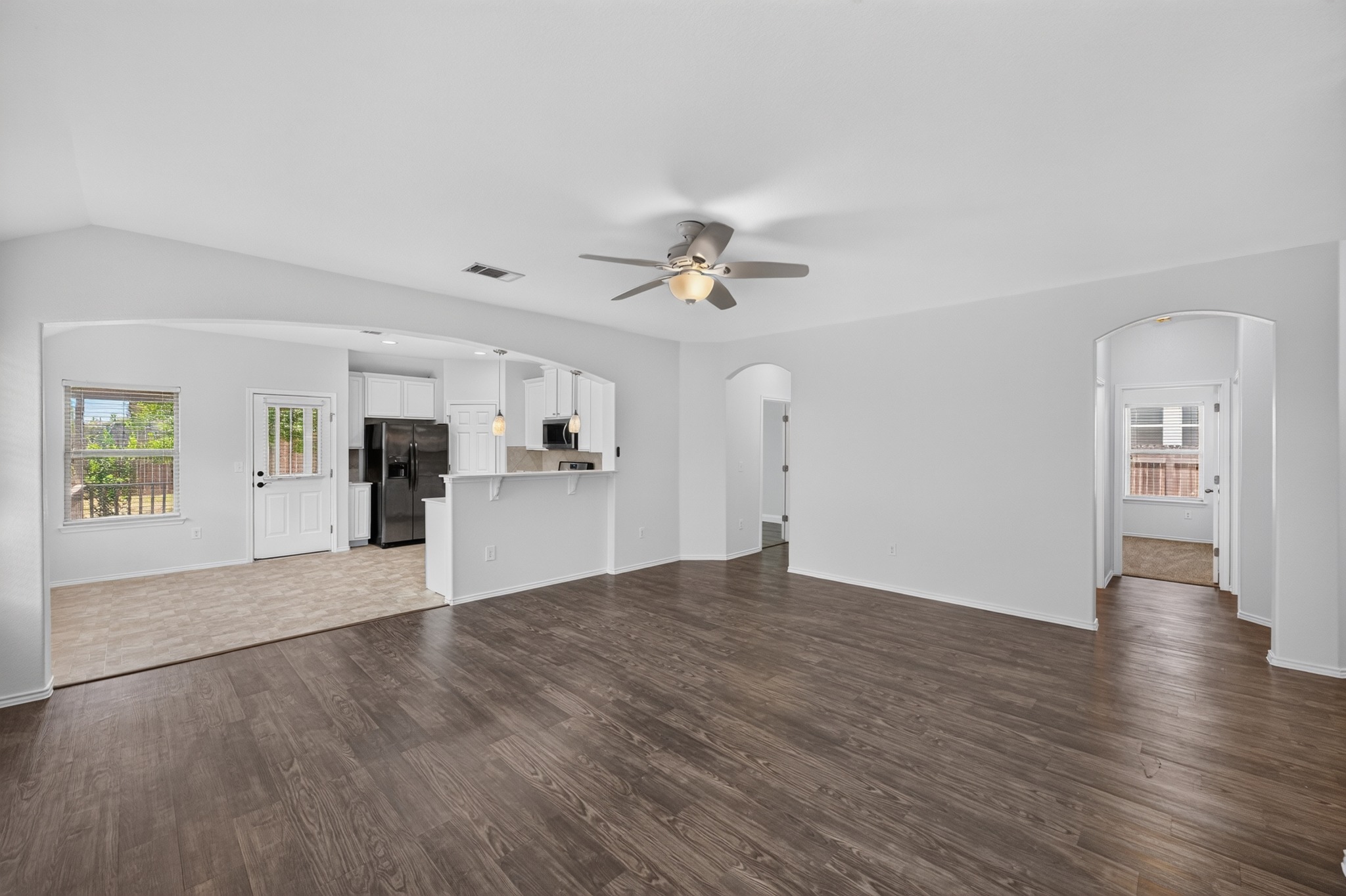 278 Noddy Road Buda, TX 78610 - Photo 6 of 17 An open concept design seamlessly connects the living area to a well-appointed kitchen.