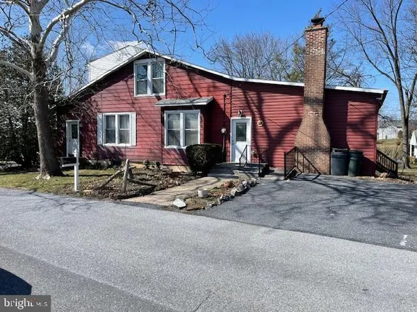 a front view of a house with yard