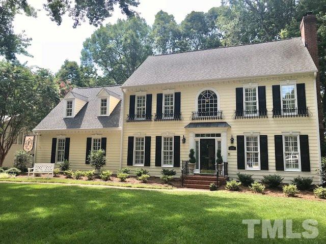 8108 Windsor Ridge Drive Raleigh, NC 27615 - Photo 1 of 25 a front view of a house with swimming pool and garden