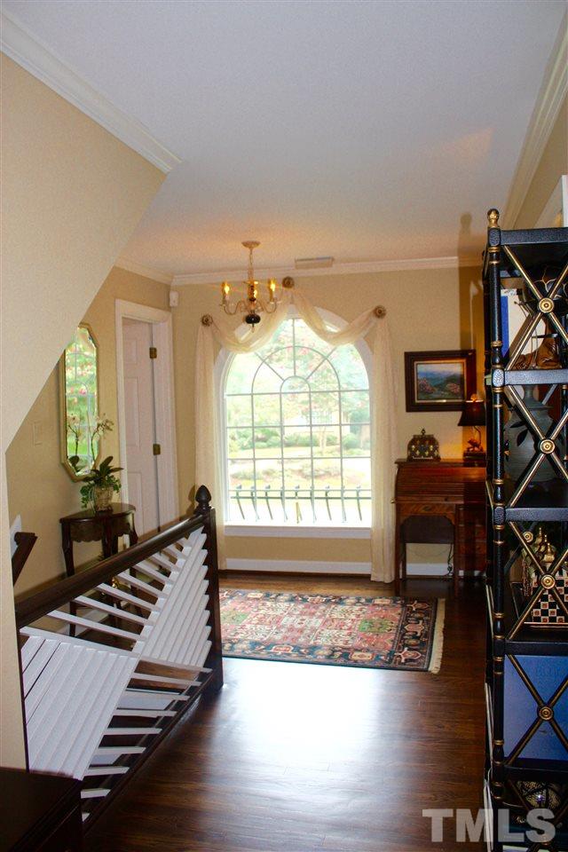 8108 Windsor Ridge Drive Raleigh, NC 27615 - Photo 25 of 25 a living room with furniture fireplace and wooden floor