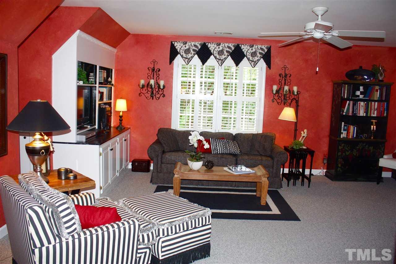 8108 Windsor Ridge Drive Raleigh, NC 27615 - Photo 11 of 25 a living room with furniture a lamp and large window