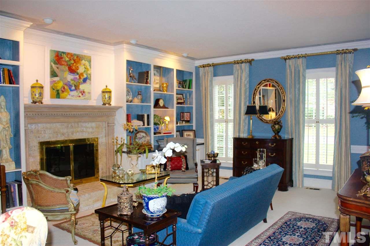 8108 Windsor Ridge Drive Raleigh, NC 27615 - Photo 14 of 25 a living room with furniture fireplace and a large window