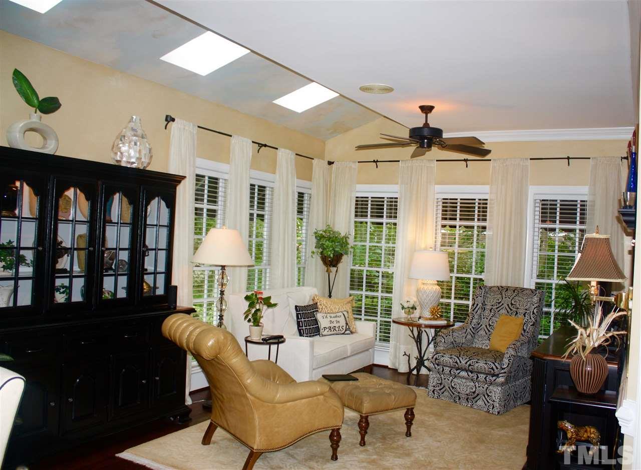 8108 Windsor Ridge Drive Raleigh, NC 27615 - Photo 18 of 25 a living room with furniture and two large window