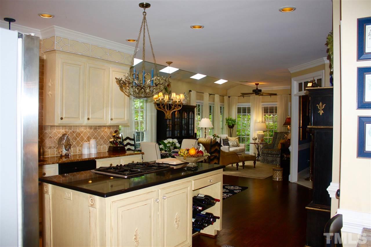 8108 Windsor Ridge Drive Raleigh, NC 27615 - Photo 21 of 25 a kitchen with a sink stove and refrigerator
