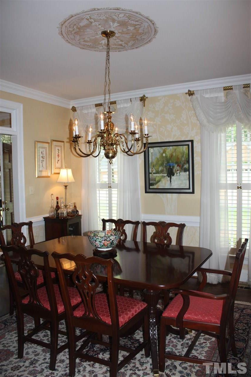8108 Windsor Ridge Drive Raleigh, NC 27615 - Photo 23 of 25 a view of a dining room with furniture