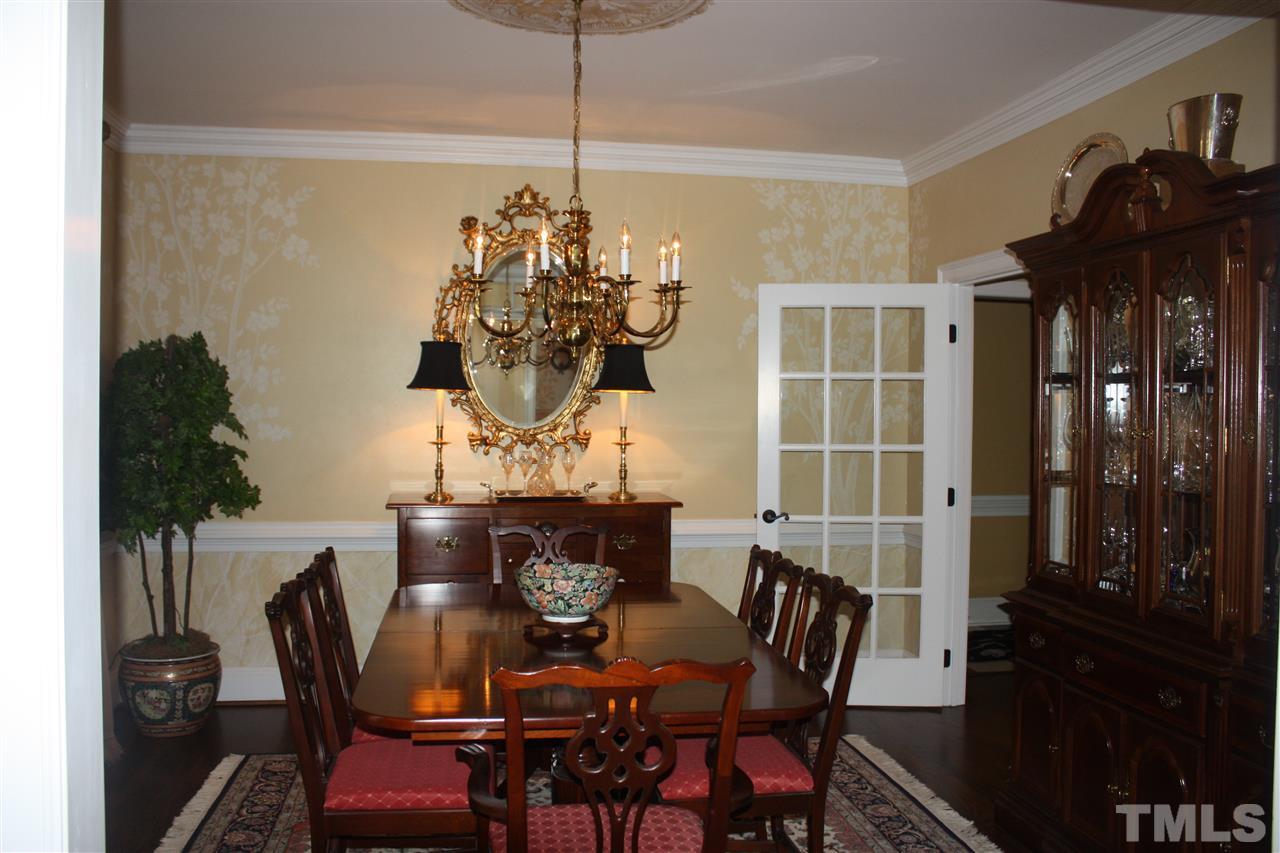 8108 Windsor Ridge Drive Raleigh, NC 27615 - Photo 24 of 25 a dining room with furniture and chandelier