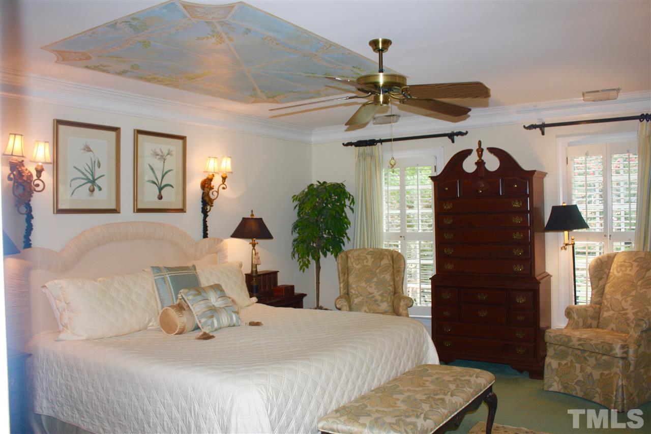 8108 Windsor Ridge Drive Raleigh, NC 27615 - Photo 8 of 25 a bedroom with a bed mirror and window
