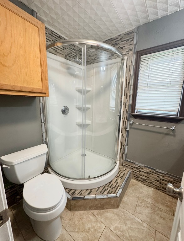 110 Marek Road Elgin, TX 78621 - Photo 15 of 27 a bathroom with a toilet and a shower
