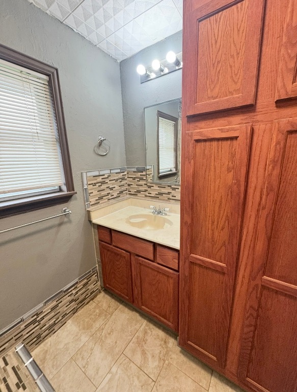 110 Marek Road Elgin, TX 78621 - Photo 16 of 27 a bathroom with a sink and a mirror
