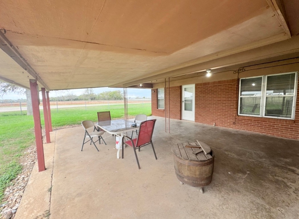 110 Marek Road Elgin, TX 78621 - Photo 21 of 27 a building outdoor space with patio furniture and garden view