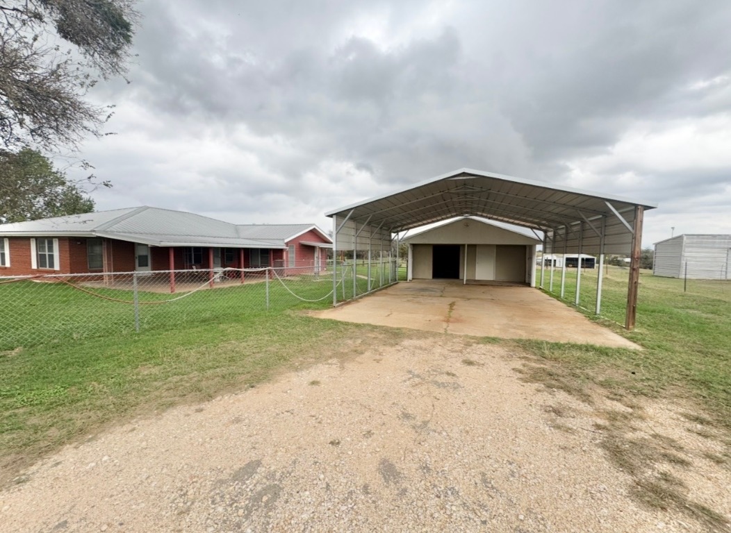 110 Marek Road Elgin, TX 78621 - Photo 25 of 27 a front view of a house with yard and green space