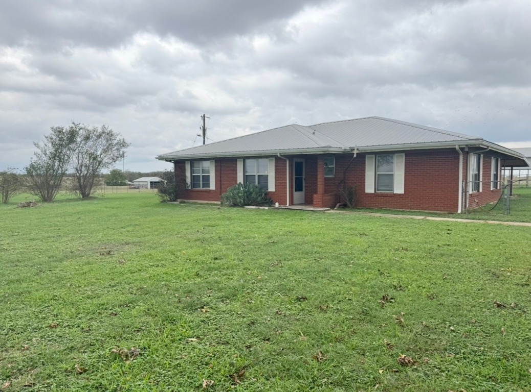110 Marek Road Elgin, TX 78621 - Photo 3 of 27 a front view of house with yard and green space