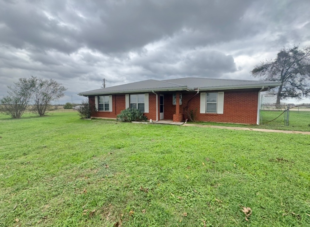 110 Marek Road Elgin, TX 78621 - Photo 4 of 27 a front view of house with yard and green space