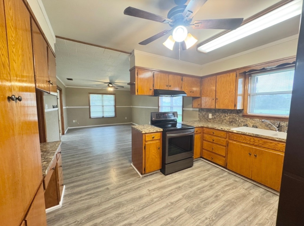 110 Marek Road Elgin, TX 78621 - Photo 27 of 27 a kitchen with stainless steel appliances granite countertop a sink stove and refrigerator