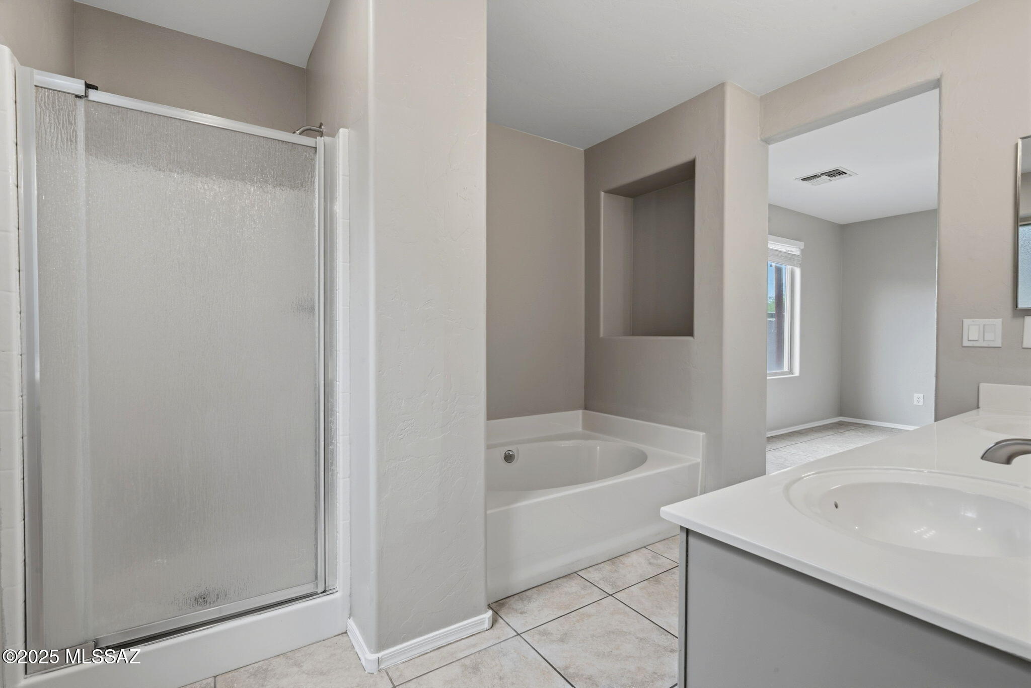 8244 South Lost Mountain Road Tucson, AZ 85747 - Photo 22 of 41 a bathroom with a sink and a bathtub