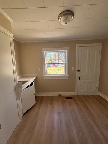 a view of a kitchen with a dishwasher cabinets and a window