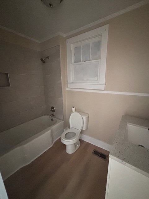 118 North 3rd Street, Unit 1 Pulaski, TN 38478 - Photo 9 of 15 a bathroom with a sink a toilet and bathtub