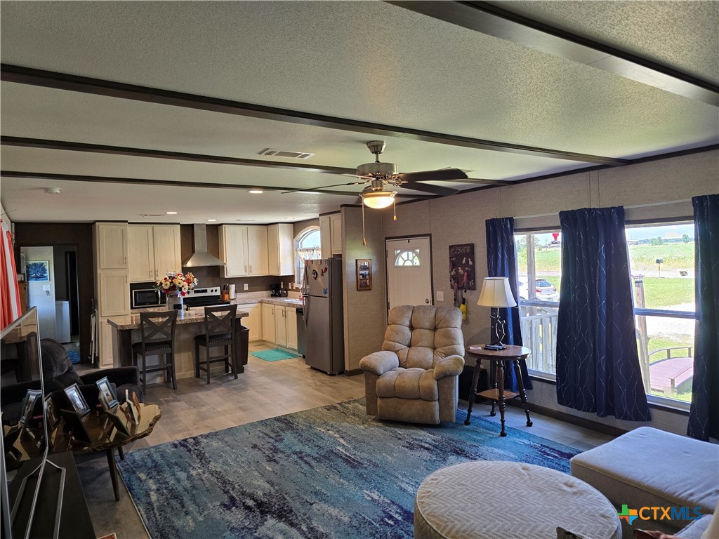 412 Coryell City Road Gatesville, TX 76528 - Photo 5 of 34 a living room with furniture and wooden floor
