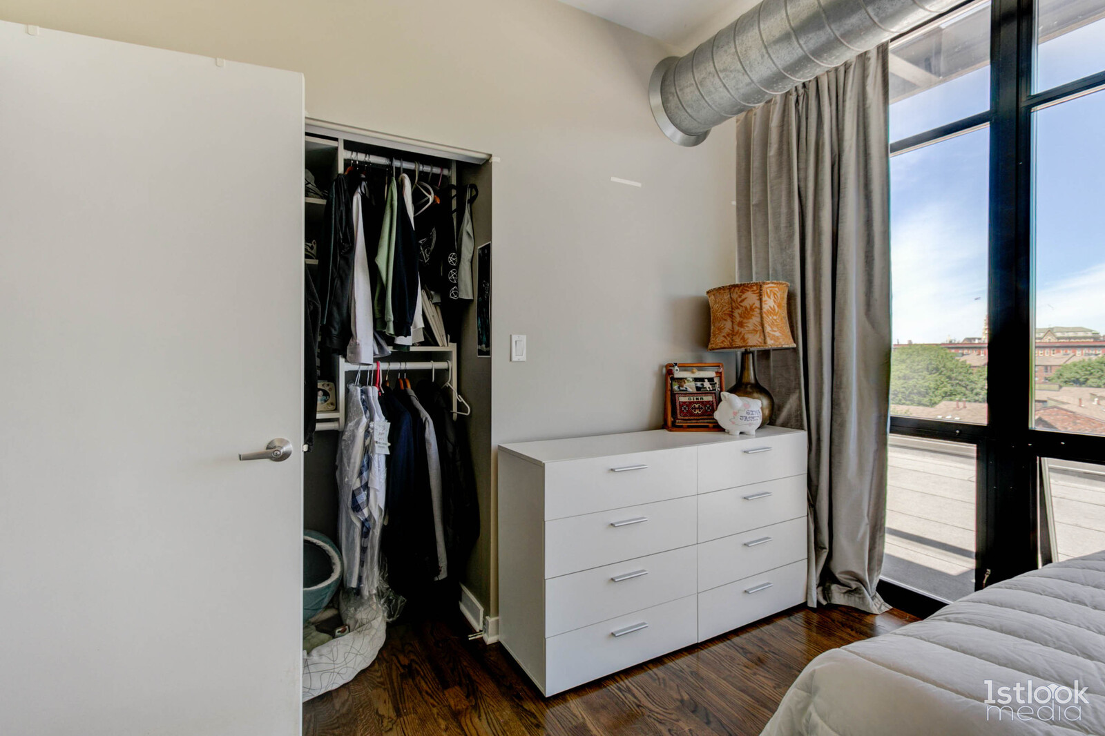 1033 West 14th Place, Unit 413 Chicago, IL 60608 - Photo 12 of 42 a view of walk in closet with clothes and shoes