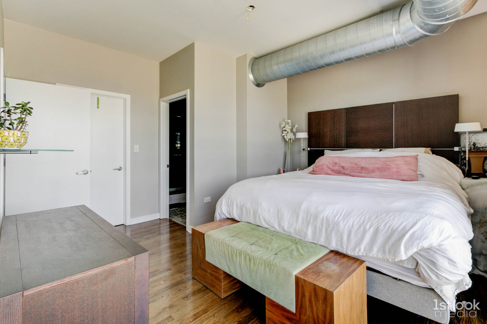 1033 West 14th Place, Unit 413 Chicago, IL 60608 - Photo 17 of 42 a bedroom with a bed and a television