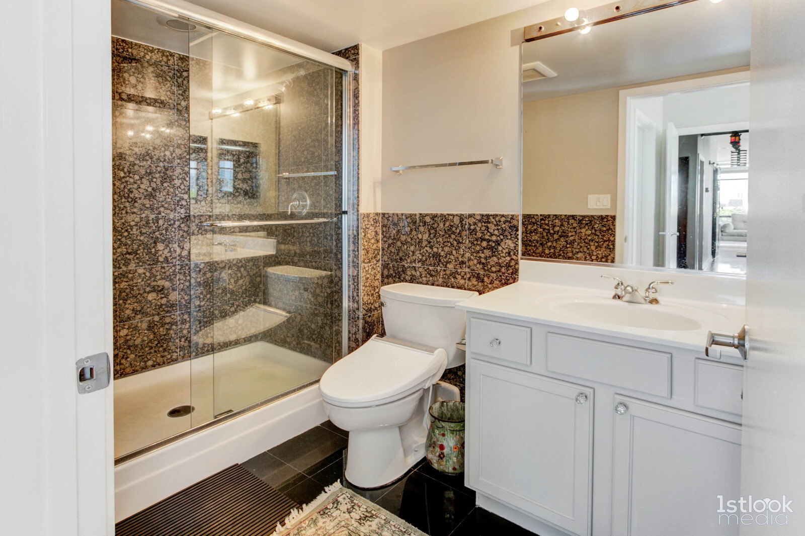 1033 West 14th Place, Unit 413 Chicago, IL 60608 - Photo 18 of 42 a bathroom with a sink toilet and shower
