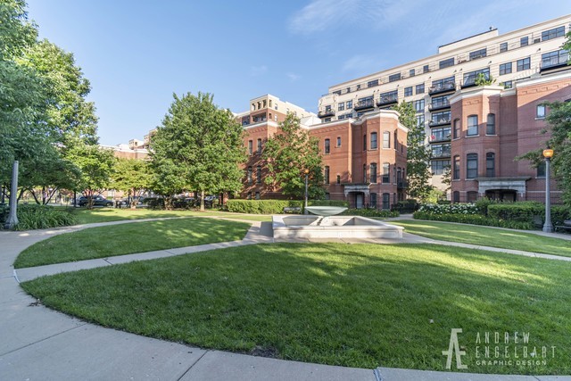 1033 West 14th Place, Unit 413 Chicago, IL 60608 - Photo 38 of 42 a view of a big building with a big yard and large trees