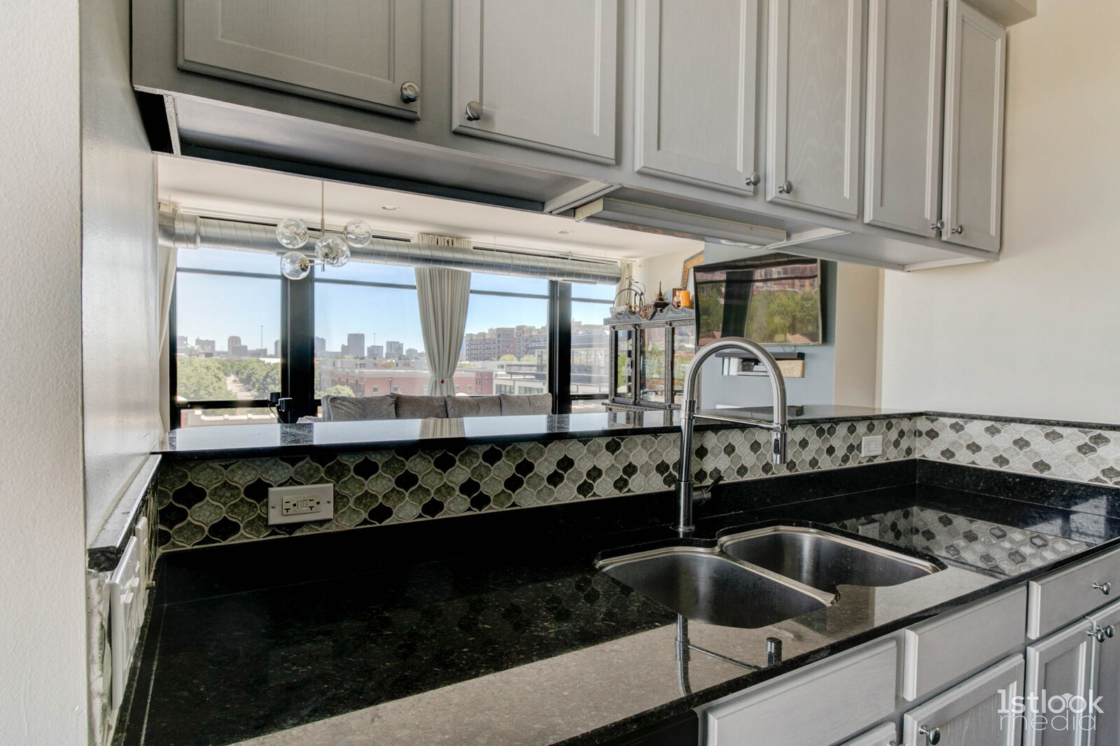 1033 West 14th Place, Unit 413 Chicago, IL 60608 - Photo 8 of 42 a kitchen with a sink and cabinets