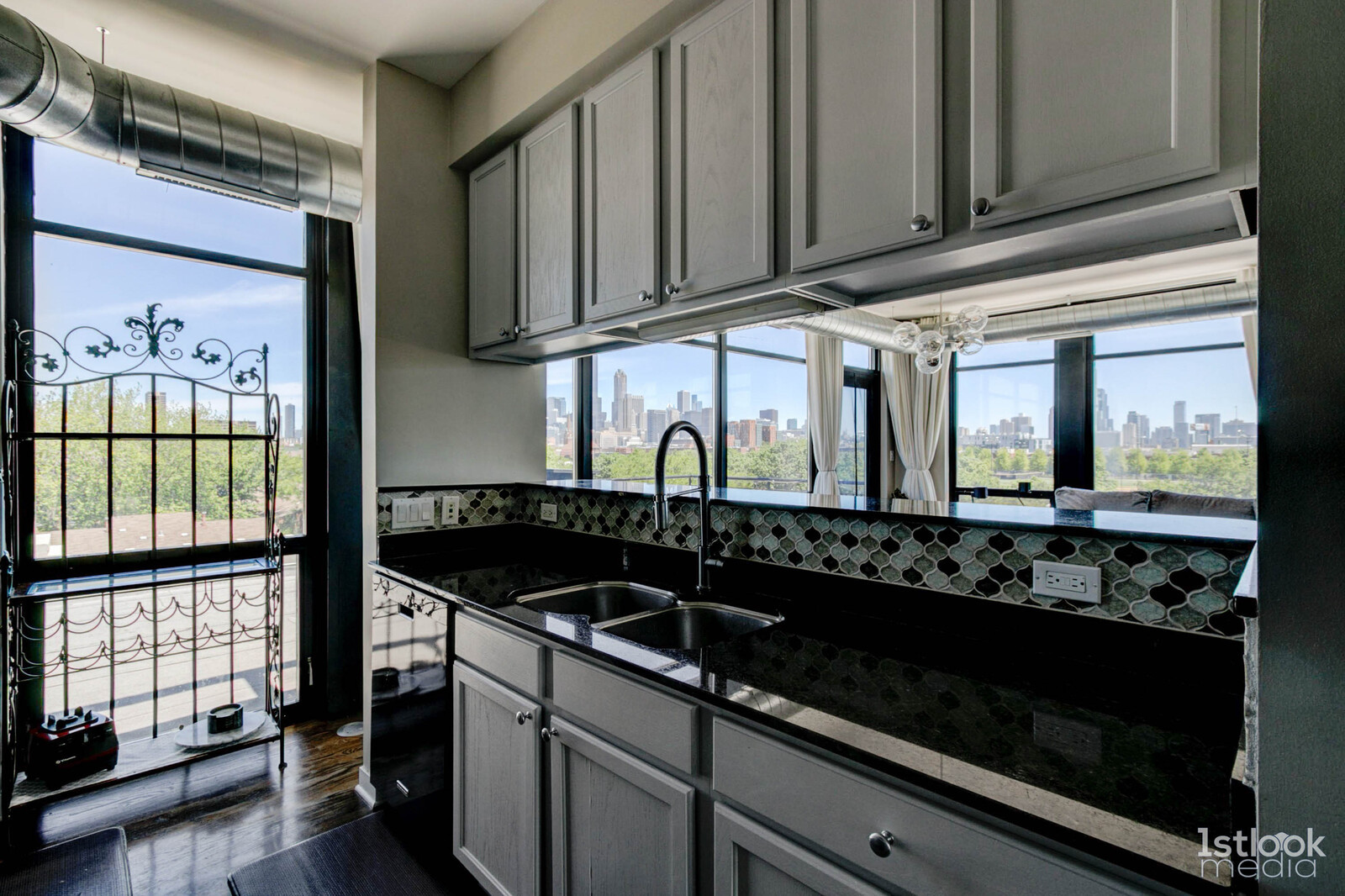 1033 West 14th Place, Unit 413 Chicago, IL 60608 - Photo 10 of 42 a kitchen with stainless steel appliances granite countertop a stove and a microwave