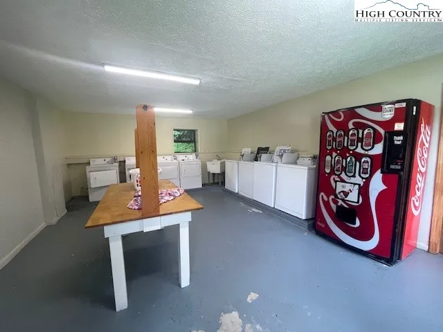 a view of a room with furniture and window