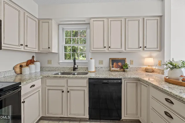 a bed room with a bed and a chandelier