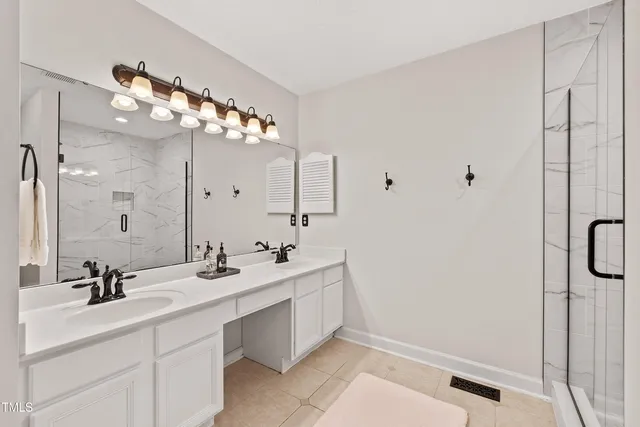 a view of a swimming pool with lawn chairs under an umbrella