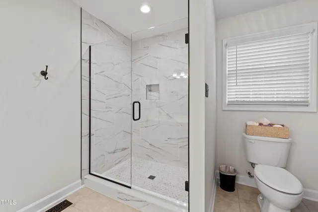 an aerial view of residential houses with outdoor and green space