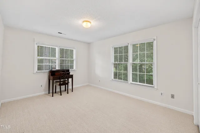 an aerial view of residential houses with outdoor space and swimming pool