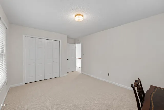 an aerial view of a house with a yard and garden