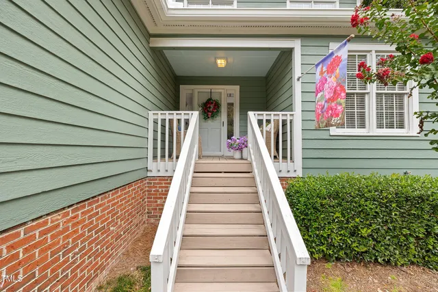 a living room with furniture and a mirror