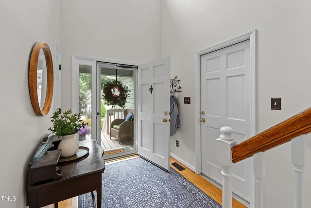 a kitchen with stainless steel appliances granite countertop a sink refrigerator and cabinets