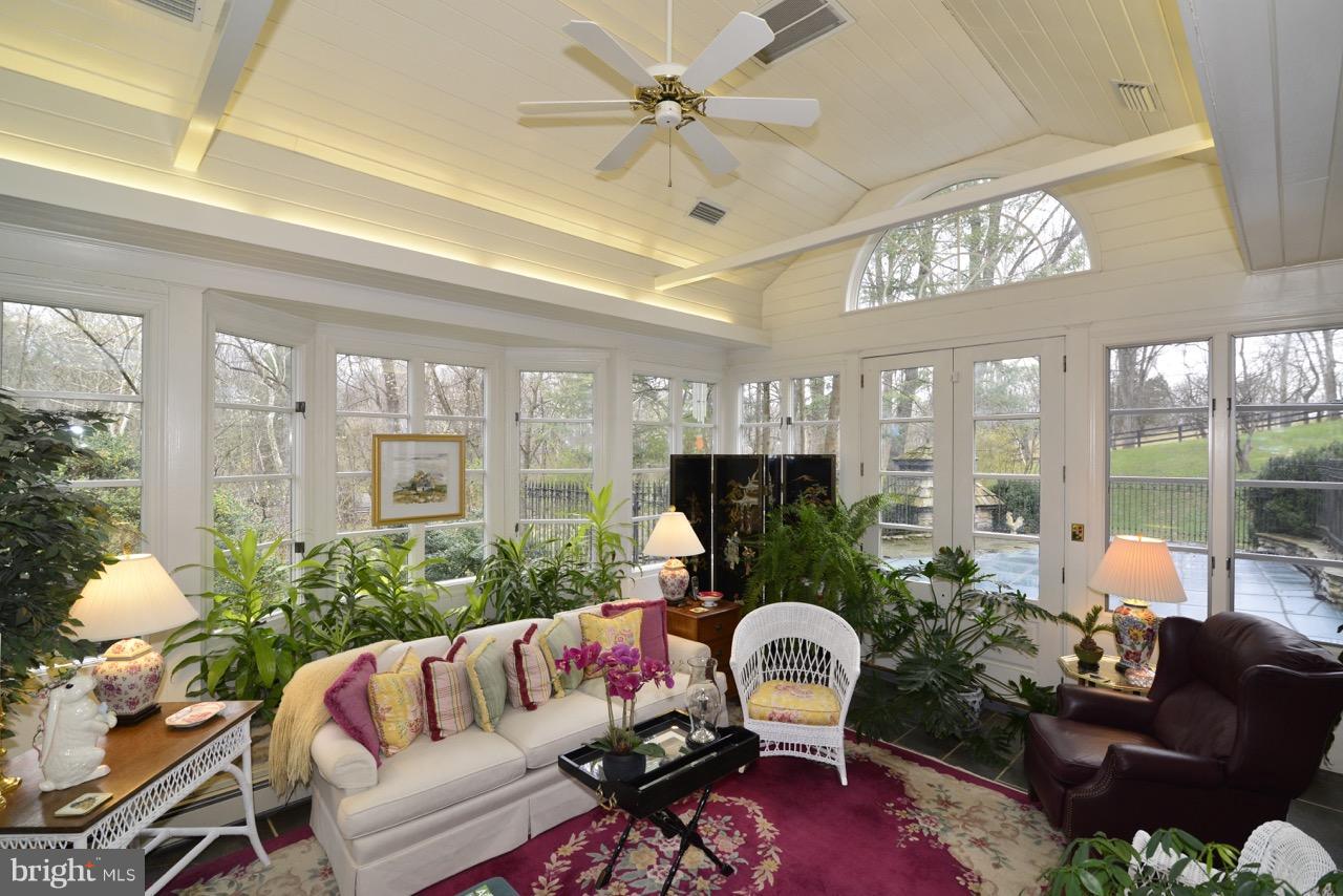 3072 Swift Shoals Road Boyce, VA 22620 - Photo 13 of 30 a living room with furniture fireplace and large windows