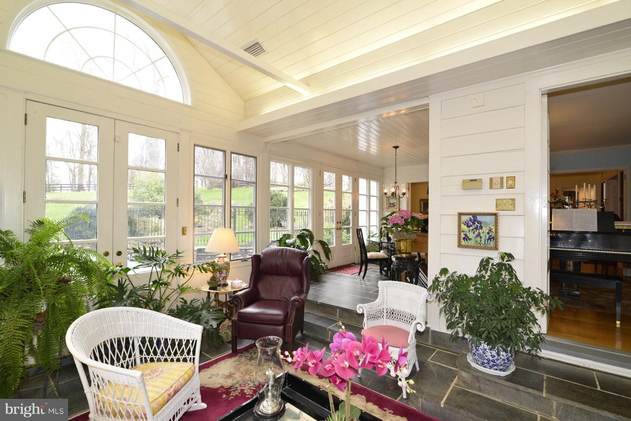 3072 Swift Shoals Road Boyce, VA 22620 - Photo 15 of 30 a living room with furniture and a floor to ceiling window