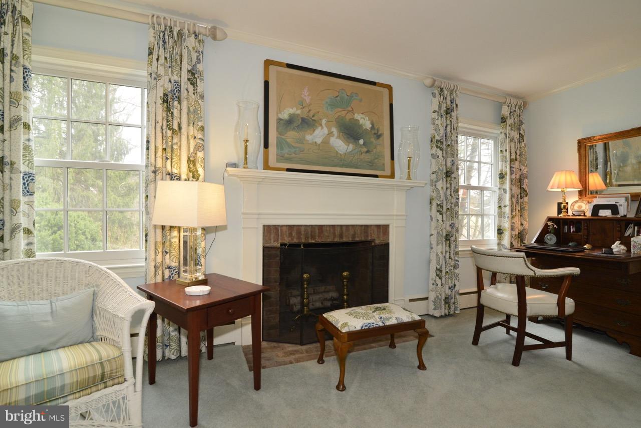 3072 Swift Shoals Road Boyce, VA 22620 - Photo 24 of 30 a living room with furniture a table and a fireplace