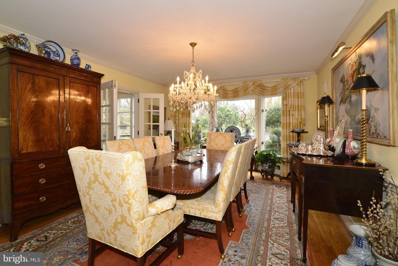 3072 Swift Shoals Road Boyce, VA 22620 - Photo 7 of 30 a dining room with furniture a chandelier and wooden floor