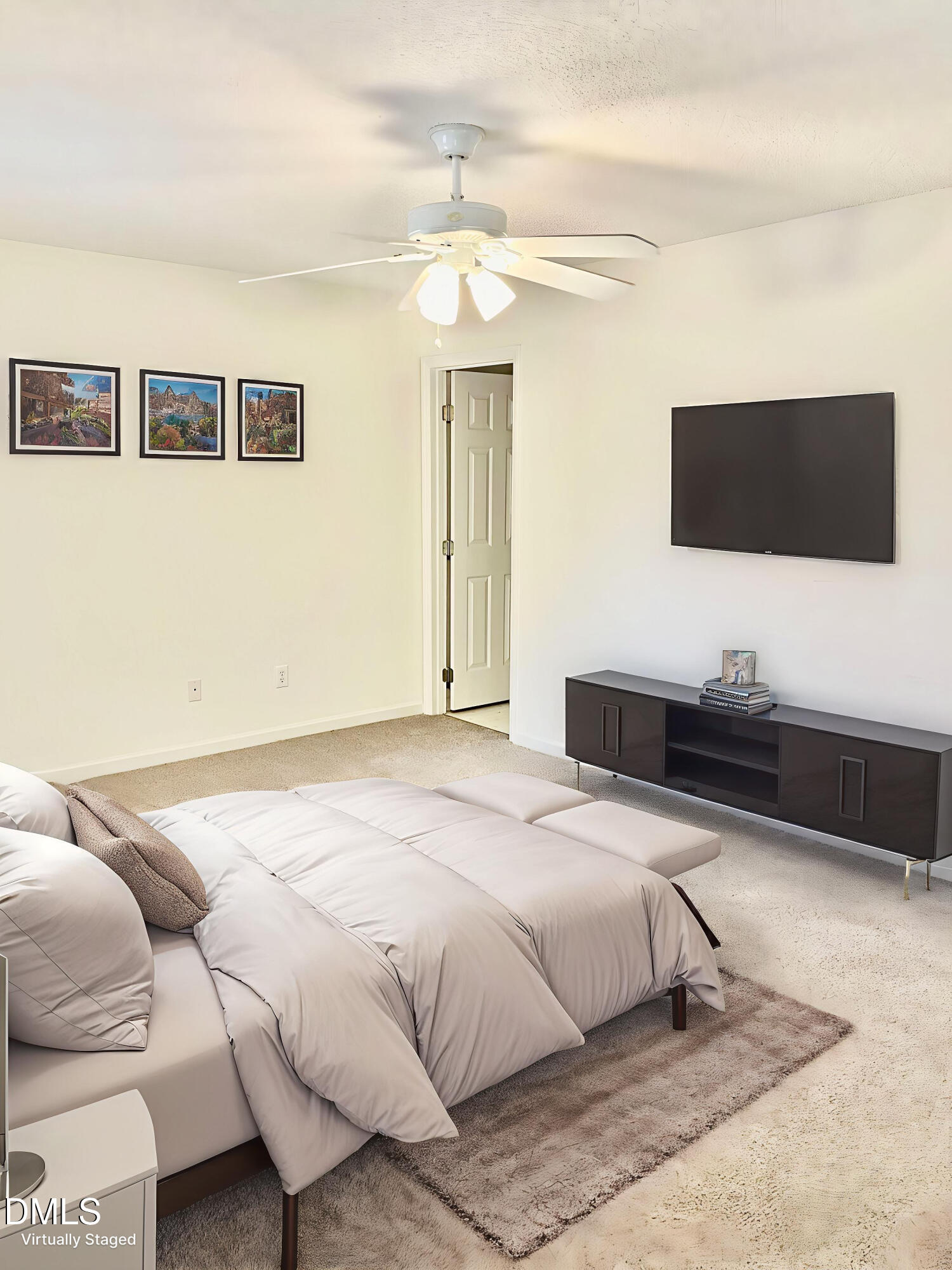 5100 Mass Rock Drive Raleigh, NC 27610 - Photo 16 of 30 a bedroom with a bed and a flat screen tv