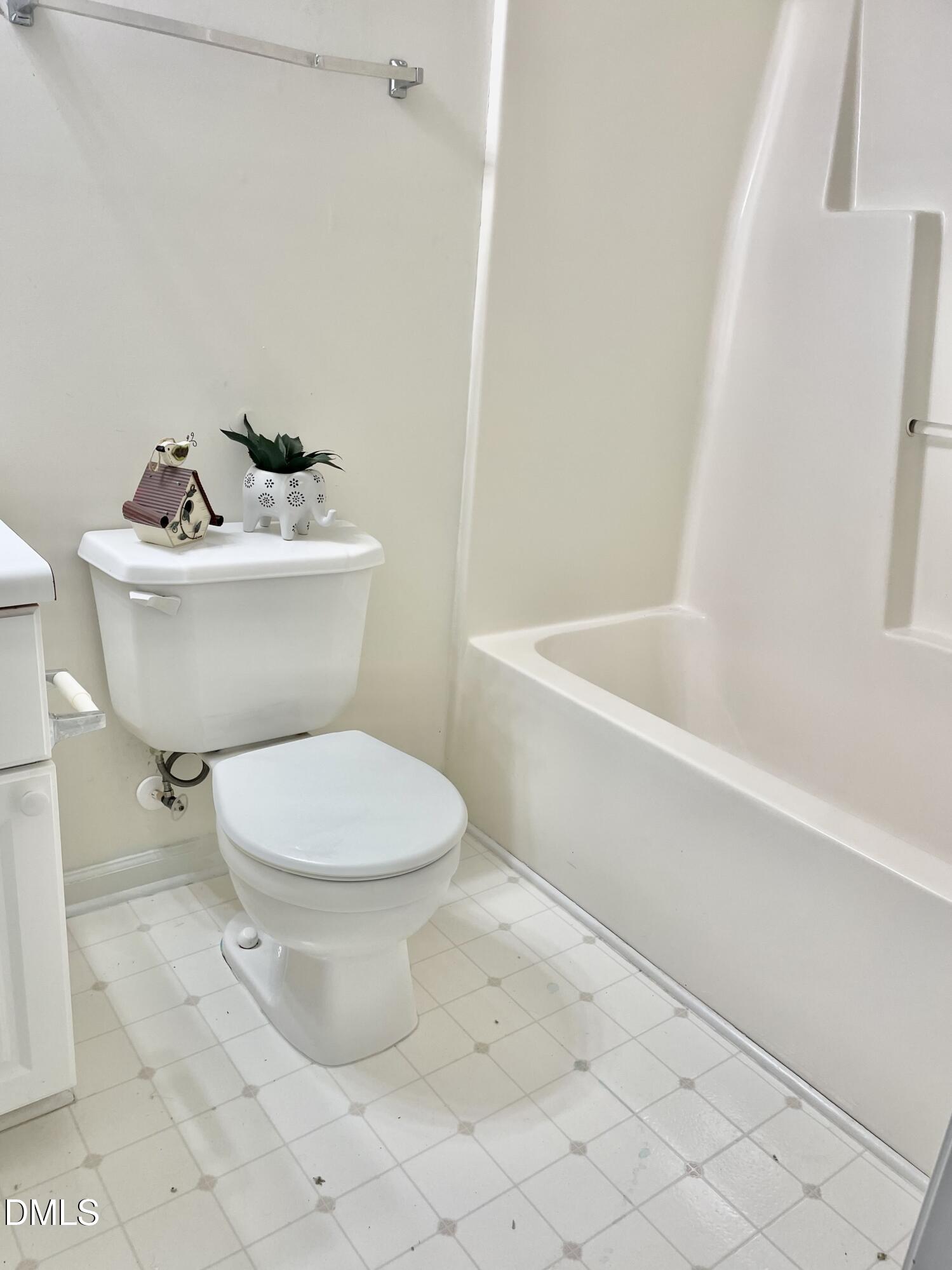 5100 Mass Rock Drive Raleigh, NC 27610 - Photo 27 of 30 a bathroom with a toilet a sink and bathtub