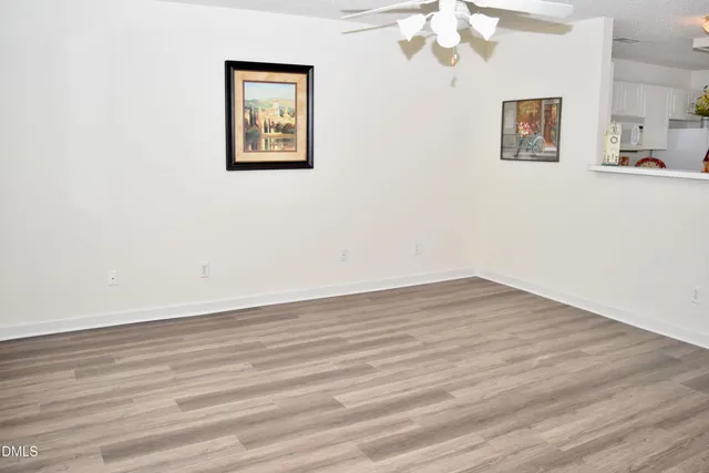 a view of livingroom with hardwood floor and hallway