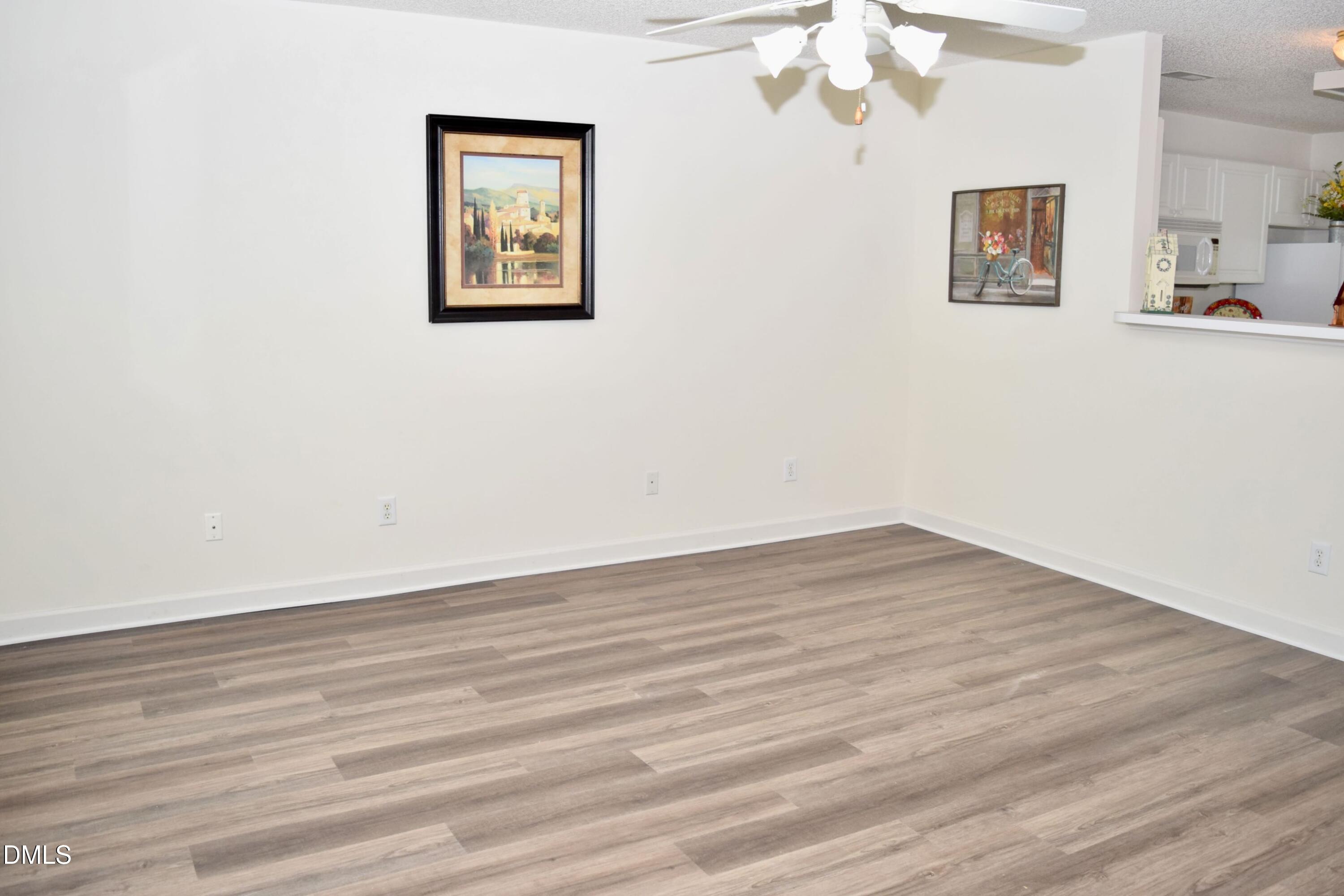 5100 Mass Rock Drive Raleigh, NC 27610 - Photo 4 of 30 a view of livingroom with hardwood floor and hallway