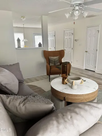 a living room with furniture and a table