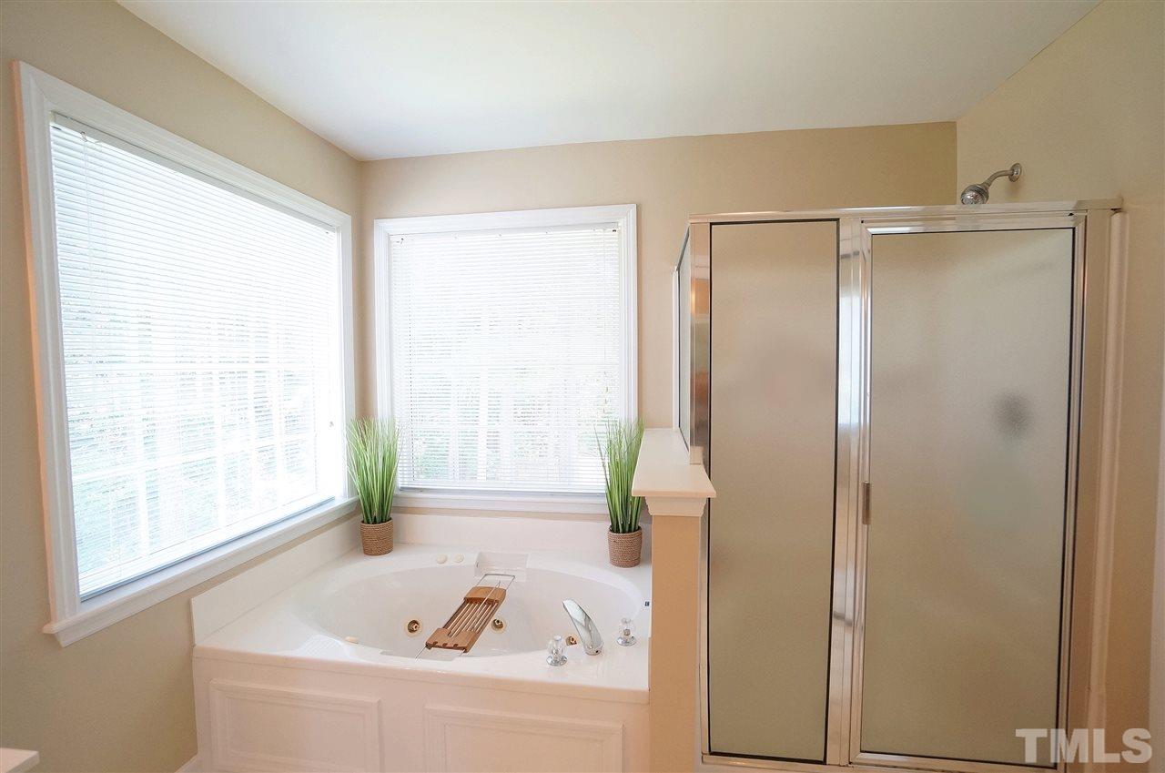8400 Neuse Rapids Road Raleigh, NC 27616 - Photo 11 of 20 Garden tub framed by large windows for beautiful light.