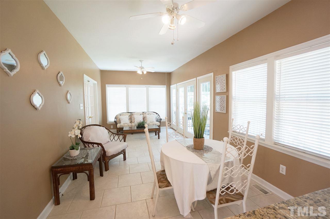 8400 Neuse Rapids Road Raleigh, NC 27616 - Photo 6 of 20 Breakfast area extends to a lovely sitting area that opens up to the large back deck.